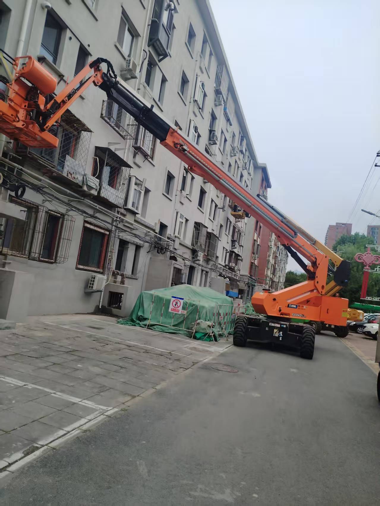 诠释城市更新厚度！Z6官网高机画出老旧幼区刷新“同心圆”